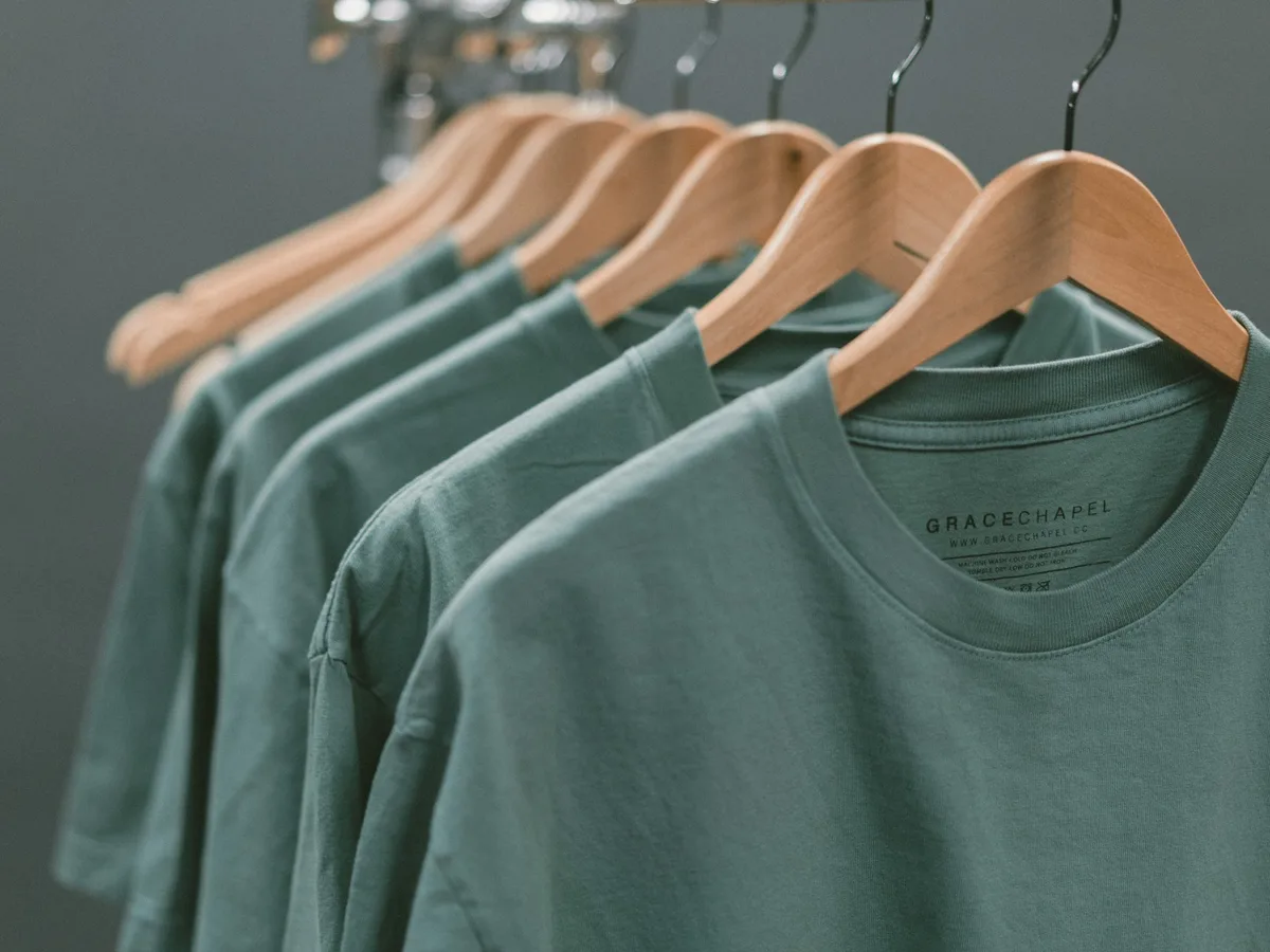 Custom apparel categories displayed on a clothing rack